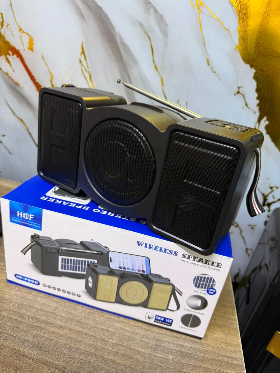 Wireless Music HF-F999 Retro Portable Wireless Speaker : A Multifunctional Party Speaker Built With Integrated Phone Holders and LED light effects.